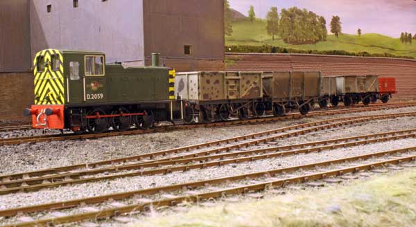 There must have been a engine failure and a BR diesel has been hired to to shunt the colliery sidings.