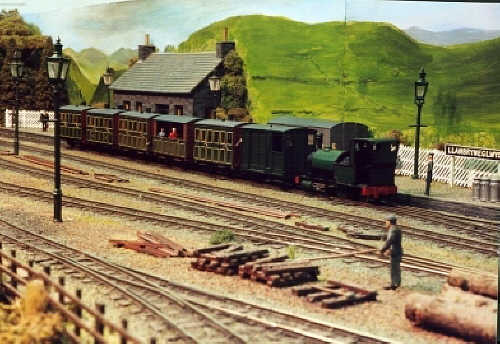 A passenger train stands at Llanbryneglwys Station.
