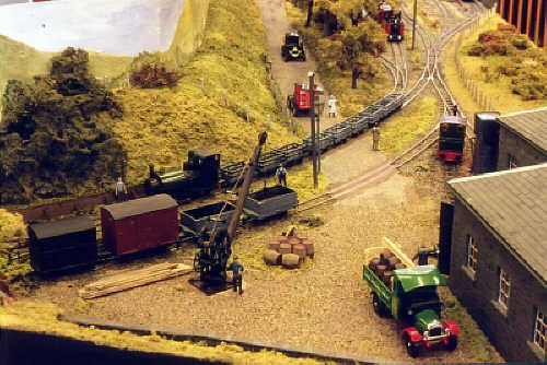 A train of empty slate wagons leaves Talybont.