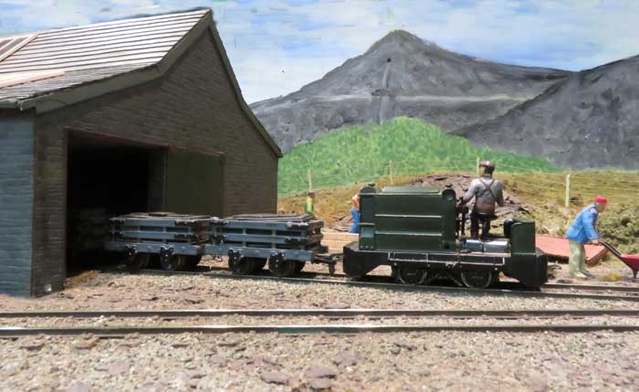 A Ruston diesel leaves the dressing shed with a full slate train.